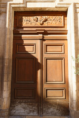 Old ornate door in Paris - typical old apartment buildiing.