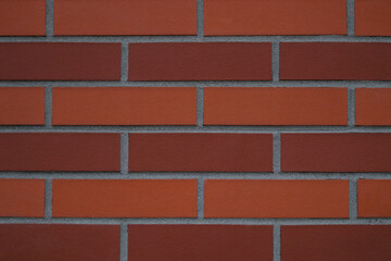 Naklejka premium Tekstura, ściana z pomarańczowej i czerwonej cegły