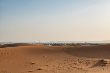 Dunes in the Sahara desert at sunset, the desert near the town of Merzouga, a beautiful African landscape