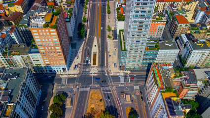 Aerial view of the long boulevard Via Vittor Pisani in front of the central train station. Roofs of...
