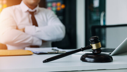 Male lawyer working with contract papers and wooden gavel on tabel in courtroom. justice and law ,attorney, court judge, concept.