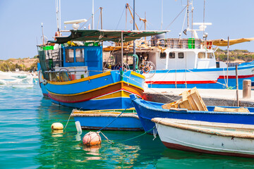 Colorful traditional Maltese fishing boats. Marsaxlokk port