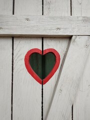 red heart on wooden wall