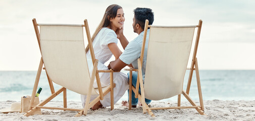 Happy, travel and love of a couple from India on a beach, ocean and sea vacation. Happiness of...