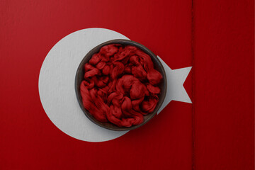 Wooden basket on background in colors of national flag. Photography and marketing digital backdrop. Turkey