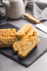 Sweet pie with nut flavor on cutting board.
