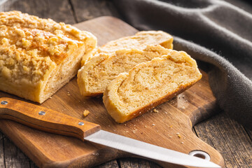 Sweet pie with nut flavor on cutting board.