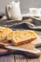 Sweet pie with nut flavor on cutting board.