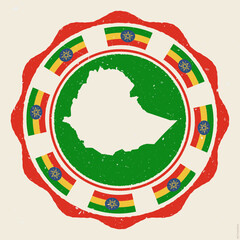 Ethiopia vintage sign. Grunge round logo with map and flags of Ethiopia. Attractive vector illustration.