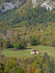 A little house in the mountains with autumn colors