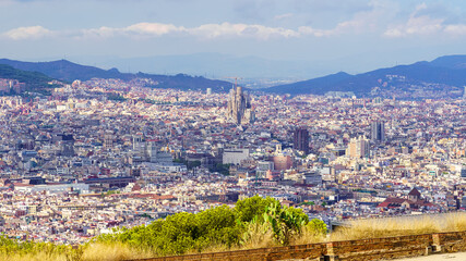 Aerial view of the city of Barcelona with the Sagrada Familia Cathedral in the city center, Spain.