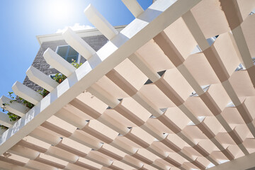 White wooden pergola roof for sun shade - obrazy, fototapety, plakaty