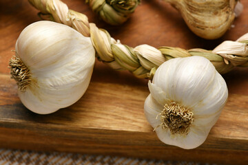 ripe garlic heads on a rustic wooden background, delicious and healthy food