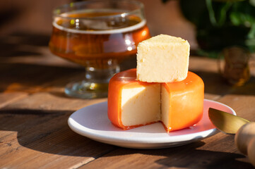 Food and drink pairing, apple cider produced on organic farm from bio apples in Normandy, France and cheddar cheese from England