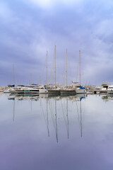 Fototapeta na wymiar Yachts in the purple sky. Spain