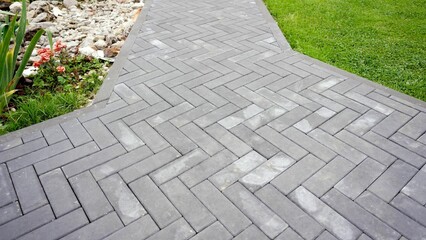 Abstract background. modern cobblestone pavement. Sidewalk made of gray stones. Walkway made of...