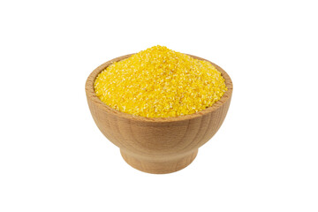 corn grits in wooden bowl isolated on white background. nutrition. food ingredient.