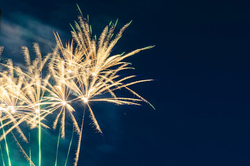 Inexpensive, budget, beautiful fireworks in the city, against the backdrop of the night sky.