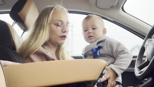 Mom With A Child In A Luxury Car Spend Time