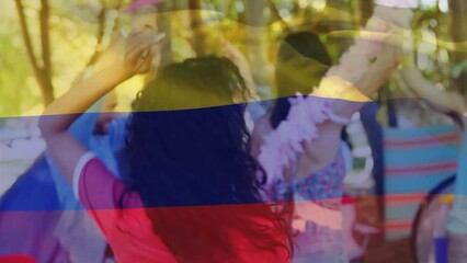 Animation of flag of colombia over diverse friends smiling - Powered by Adobe