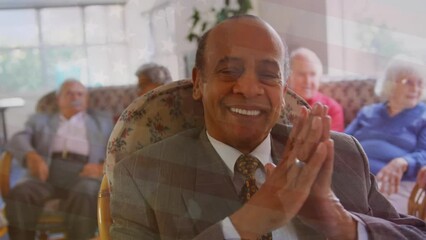 Animation of flag of usa over african american businessman and senior diverse people - Powered by Adobe