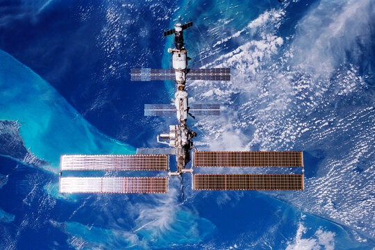 International space station over the planet. Elements of this image furnished by NASA