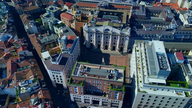 Aerial view of the Borsa Piazza Affari. Krishi houses in the city. Attractions for tourists. A crisis. Statue of the middle finger on the hand. Finance. Architecture. Italy, Milan, 09.2022