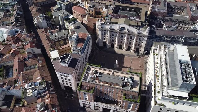 Aerial view of the Borsa Piazza Affari. Krishi houses in the city. Attractions for tourists. A crisis. Statue of the middle finger on the hand. Finance. Architecture. Italy, Milan, 09.2022