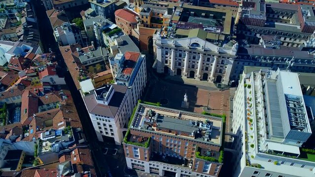 Aerial view of the Borsa Piazza Affari. Krishi houses in the city. Attractions for tourists. A crisis. Statue of the middle finger on the hand. Finance. Architecture. Italy, Milan, 09.2022
