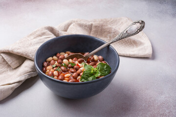 Bowl of vegetarian healthy meal with beans and tomato sauce