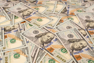 Money, US dollar bills background. Money scattered on the desk. New banknotes.  Photography for Finance and Economy concepts.