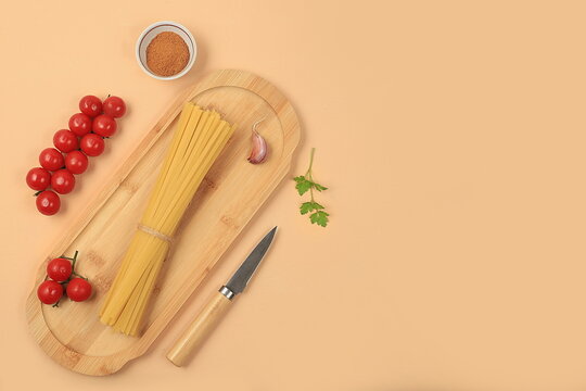 Kitchen background with ingredients for spaghetti cooking recipe, minimal cooking concept, traditional italian cuisine, business card for restaurant, cafe, shop, menu, selective focus, top view