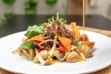 salads on a white plate with a light wood background