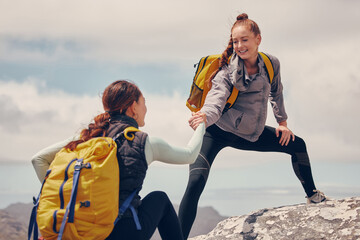 Help hands, friends or women hiking up a mountain, hill or in nature with a smile. Travel, adventure and trekking females on an outdoor, countryside or rock climbing recreation exercise activity. - obrazy, fototapety, plakaty