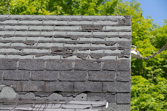 A Badly Damaged Shingles Roof