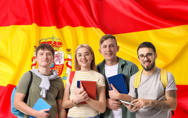 Obraz premium Group of students against flag of Spain. Concept of studying Spanish