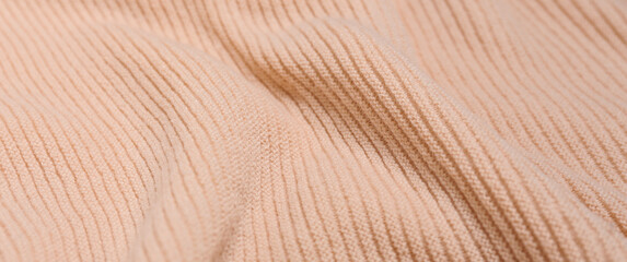 Texture of soft knitted fabric, closeup