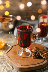 Glass cup of tasty mulled wine on table