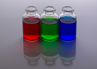 Food coloring added to water in mini glass bottles