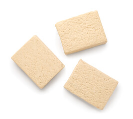 Pieces of tasty sesame halva isolated on white background