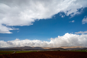 Panoramic view on agricultural valley Zafarraya with fertile soils for growing of vegetables, green...