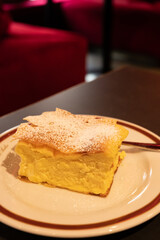 Austrian sweet dessert, filled with white cheese strudel served warm in traditional cafe in Vienna, Austria