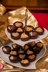 Food styling in bakery, wedding or happy valentine chocolate candies decorated with hearts and flowers