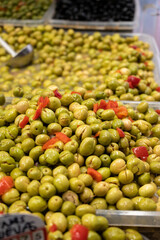 Assortment of pickled green olives on farmers market in Malaga, Andalusia, Spain
