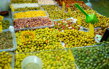 Assortment of pickled green olives on farmers market in Malaga, Andalusia, Spain