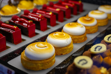 Austrian desserts, different types of chocolate and fruit cakes in traditional bakery cafe in Vienna.