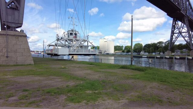 The Rendsburg railroad high bridge is considered an outstanding industrial monument.The floating ferry is passing the river