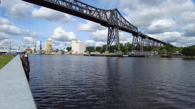 The Rendsburg railroad high bridge witha passing cargo ship.