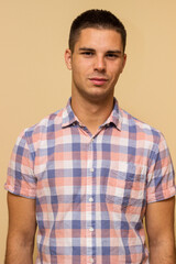 Fototapeta premium Portrait of handsome young man in casual shirt