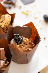 muffin set. cupcake with raspberries and crispy waffles on a beige background.Chocolate dessert.Chocolate cupcake.Assorted sweet table.Baked goods and desserts 